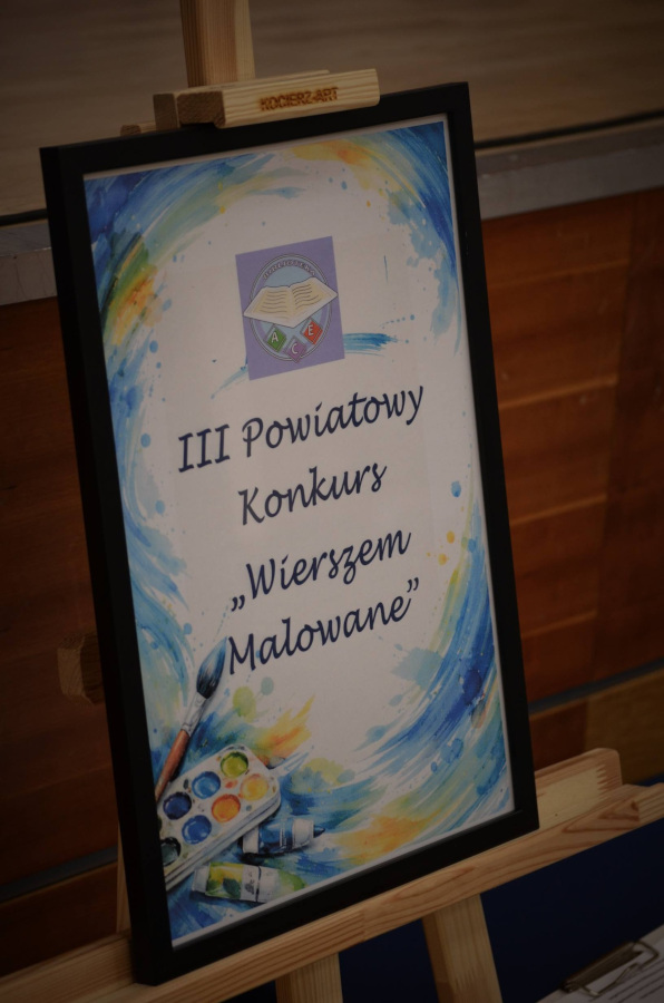 Tabliczka z nazwą konkursu: III Powiatowy Konkurs „Wierszem Malowane”.